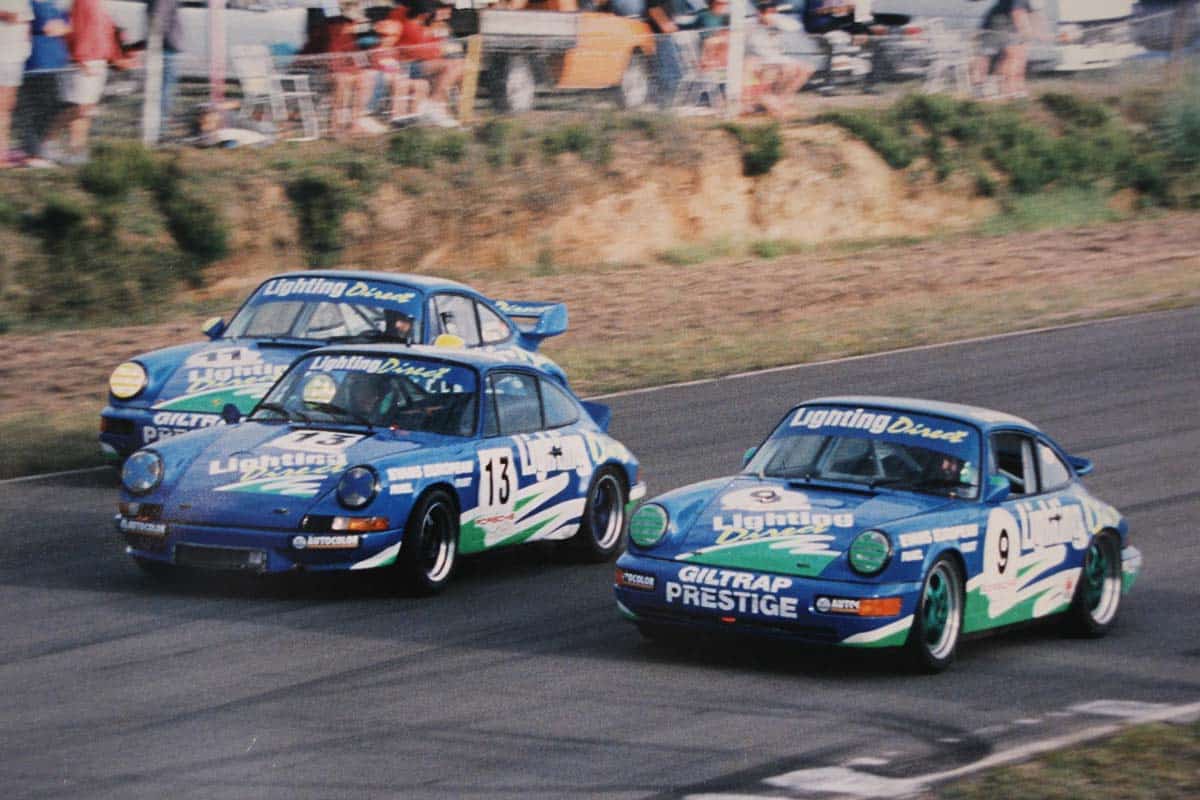 1995 Baypark – final corner of the final race held at Baypark 15 April 1995 – a handicap race with Bill #9 964 Cup Car and Owen #11 RSR 3.8 passing Dean #13 RS 2.7. Owen won from Phil Schebert with Bill 3rd. – Photo via Bill Fulford