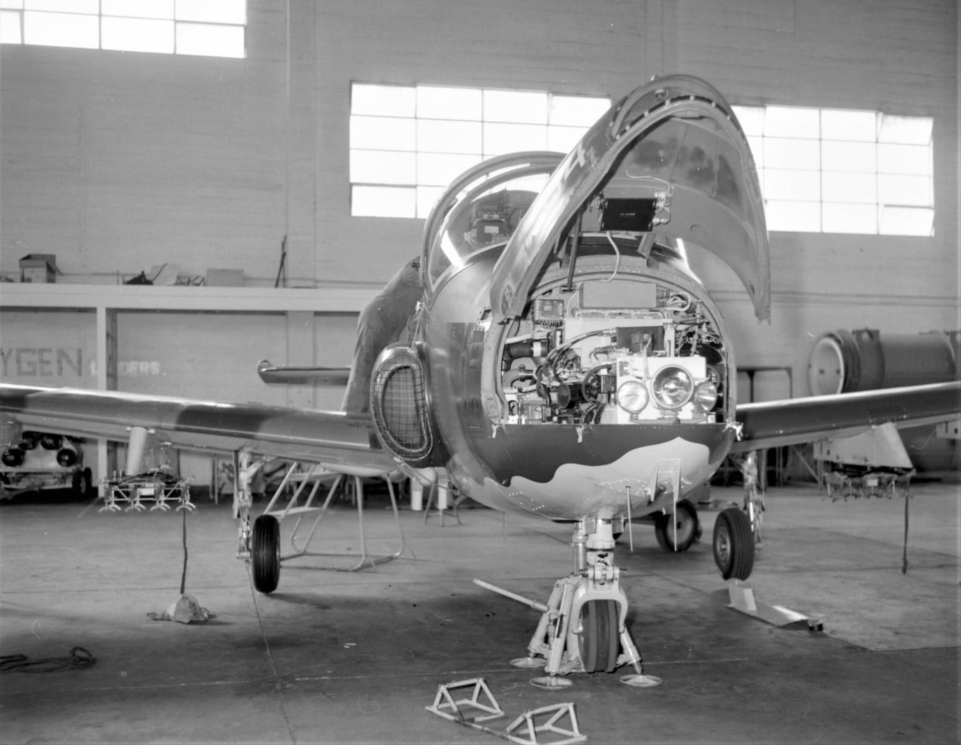 BAC Strikemaster Mk88 NZ6364 with the nose opened for easy access to radios and instrument power supplies – photo taken inside 14 Sqn’s No 2 Hangar at Ohakea – 1975 photo G2487a-75-1