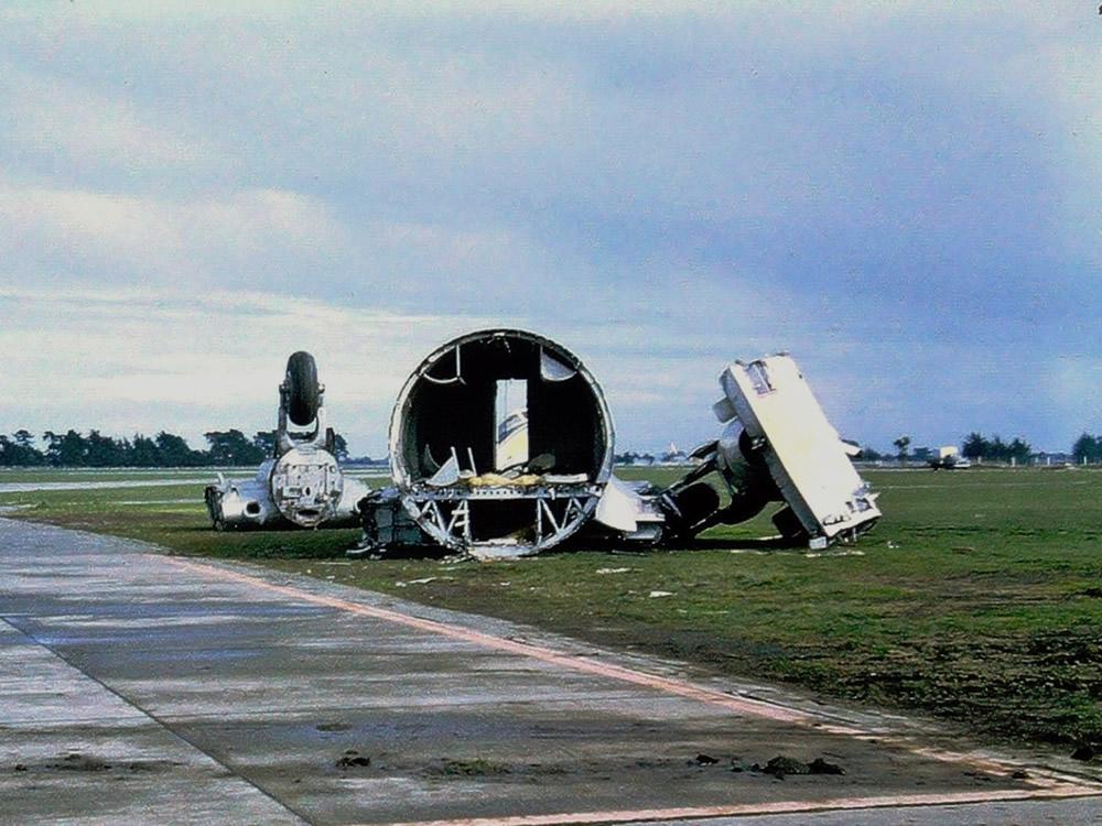 The remains of the fuselage centre section and severed main wheels of an RNZAF Hastings CMk3 – either NZ5802, or NZ5803. Some of the cockpit windows are just visible through the cockpit entry door as seen in the middle of the centre-fuselage section. Jim Barclay photo Ohakea July 1969