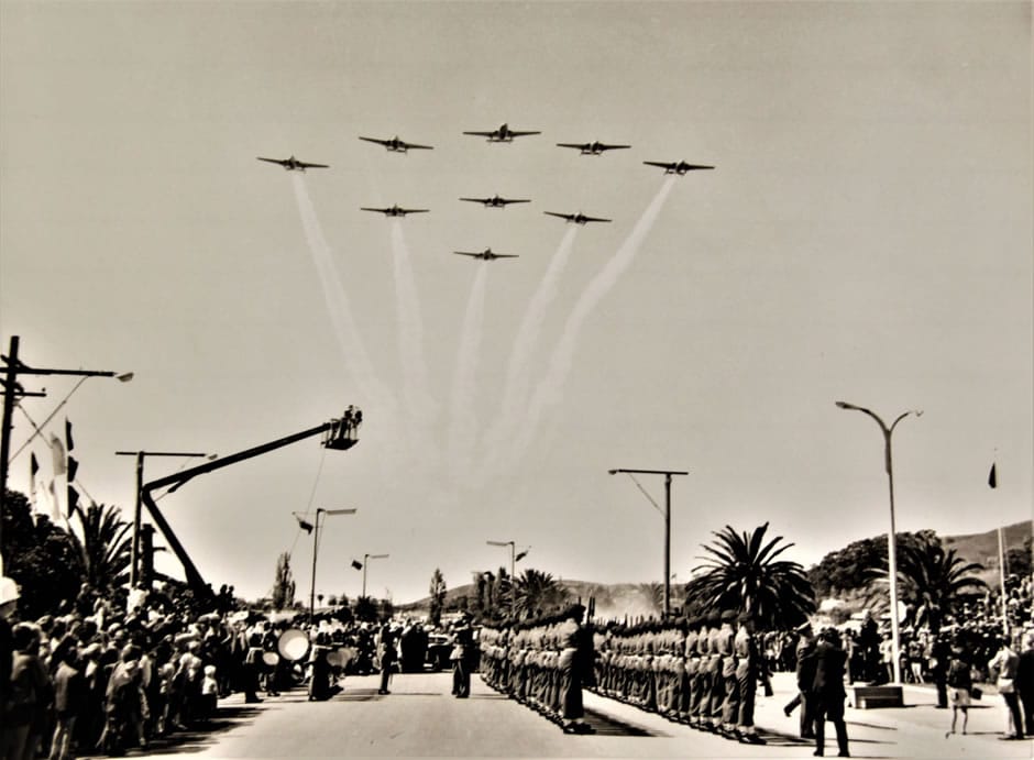75 Squadron Diamond-Nine Flypast at the Civic Ceremony, Endeavour Park, Gladstone Road, Gisborne, Thursday morning 9th October 1969. On parade at the ‘present arms’ were NZ Army soldiers with their SLR rifles, and the band on the left. Thousands of spectators lined the streets – photo RNZAF