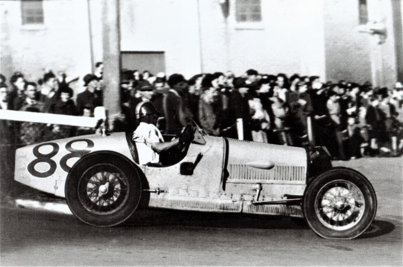 Dunedin 19 Apr 54 – 1st place to Ron Roycroft Bugatti T35A-Jaguar, who is seen touching down off the overbridge ramp. Photo Evening Star in ‘Up to Speed’.