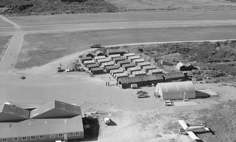 Ex Falcons Roost 15, Hokitika Apr 20th-29th 1982 – 14 Sqn tented camp – beyond the round topped hanger is the line of Mess/Bar tents with a double wheeled mini beer tanker parked outside – photo RNZAF OhG1231-82