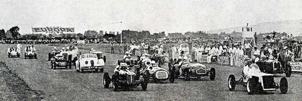 Wigram 23 Feb 52 Leading on the right, George Smith Gee Cee Ess-Mercury, leads Tom Sulman Maserati 4CM Row 2 from right – Don Ransley Alfa Romeo 8C-2300 Tourer, Des Wild Allard J2, Hec Green RA4-Vanguard Row 3 – 3rd row on the left, Jack Tutton’s white Jaguar XK120 – photo Modern Motor April 1952