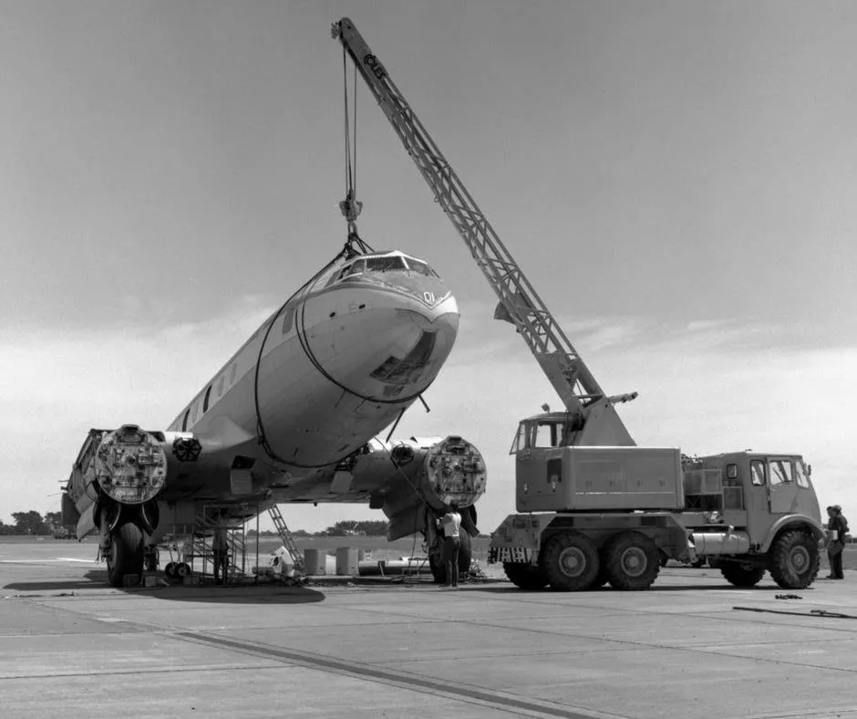 Battle of Hastings 1971. MoTaT staff and volunteers prepare to remove the front 22 feet of fuselage and nose section of Hastings NZ5801 at Ohakea in 1971 using the Coles crane Photo ref: OhG5271~70 ©RNZAF Official