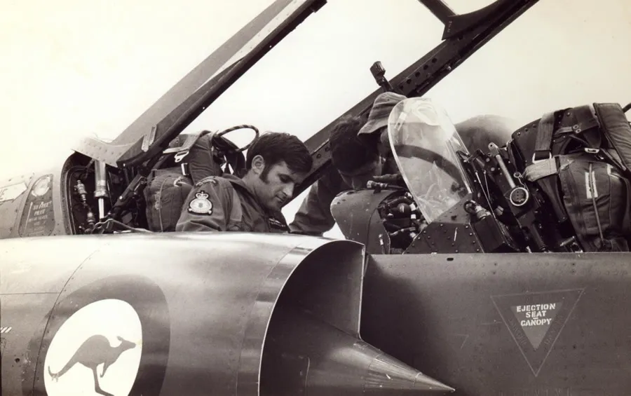 Flt Lt Jim Barclay strapping into the ejection set of 77 Squadron RAAF two-seater RAAF Mirage IIID A3-104, RAAF Base Darwin, Australia 1st June 1973