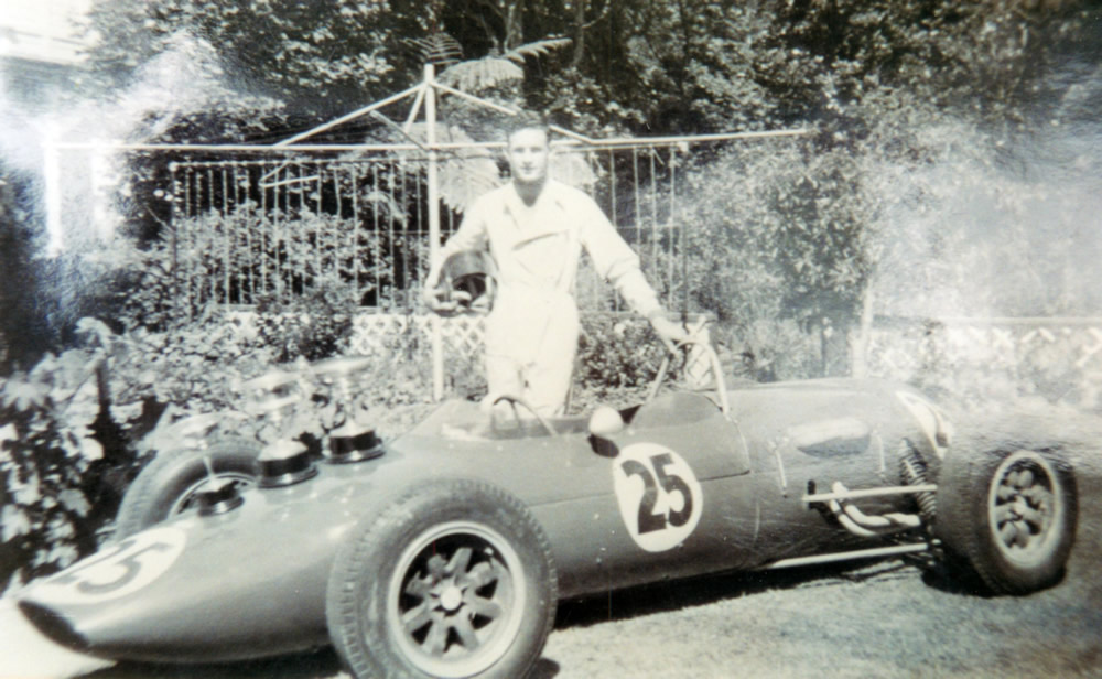 Rex with his Gemini and HVMC trophies in the garden at 716 High Street, Lower Hutt – photo Rex Flowers Collection