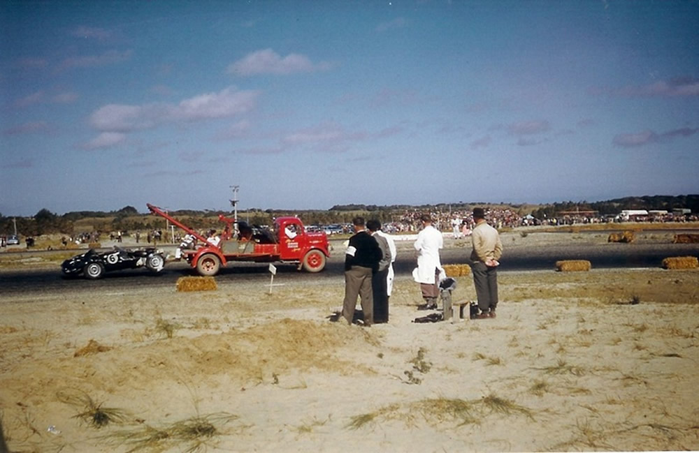 Teretonga 8 Feb 58 – Frank Cantwell’s crashed Tojeiro Jaguar on a tow truck – photo via Phil Benvin