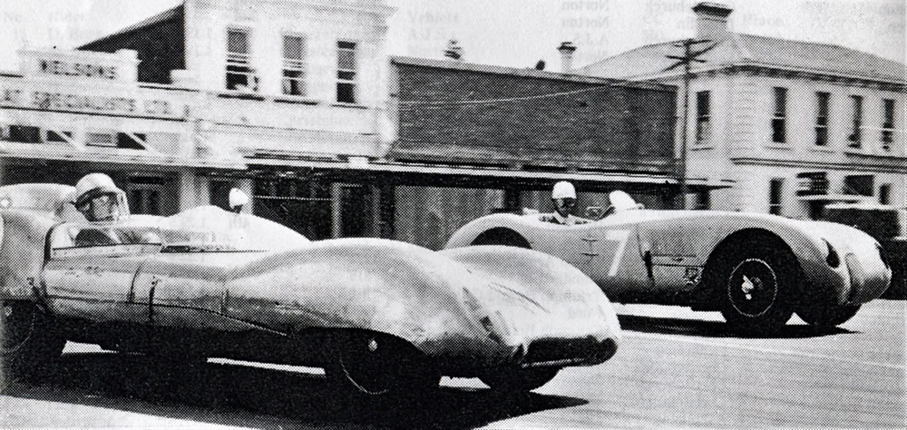 Waimate 13 Feb 60 – Sports Car race – Turn 1 from Queen Street into Victoria Terrace – Jim Palmer Lotus 15 Climax, #7 David Young Jaguar C-Type – photo from the booklet ‘The Waimate 50: An Era Past’