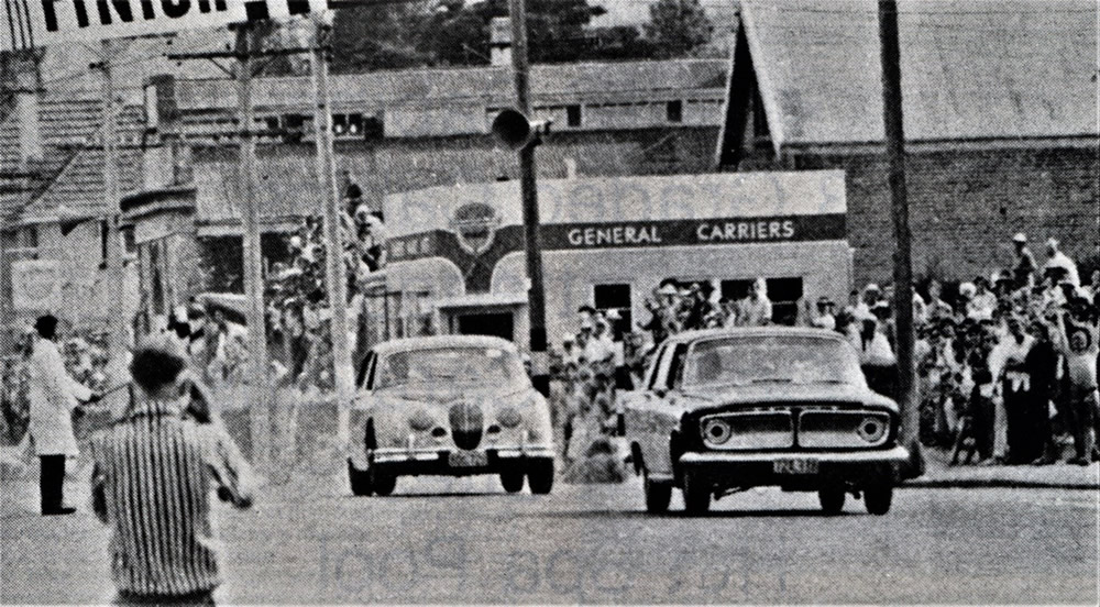 Waimate 2 Feb 63 – #50 Ernie Sprague Ford Zephyr Mk3 leads #2 Ray Archibald Jaguar Mk2 3.8– along Queen Street, the main start-finish straight - photo ‘The Racing Years - History of the Waimate 50 1959-1966’