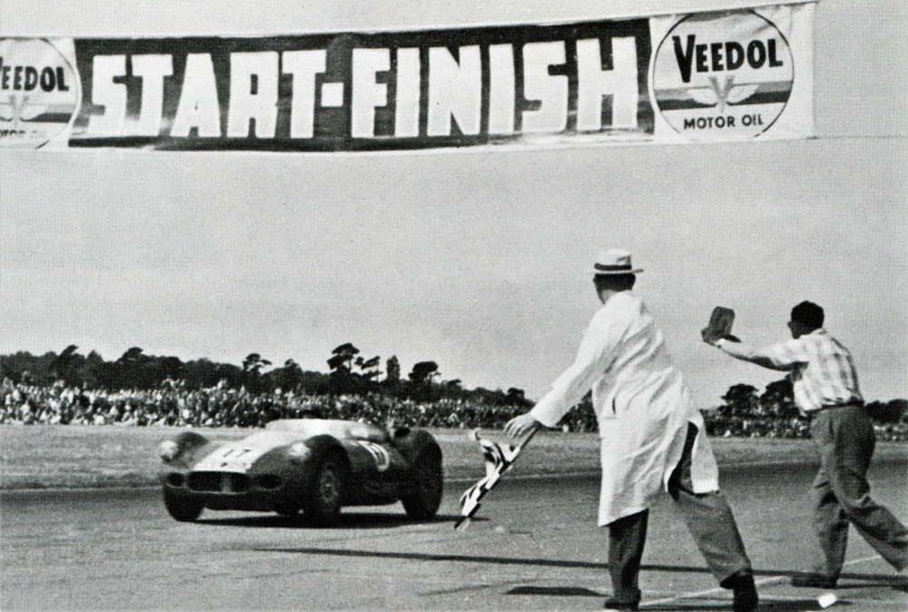Wigram 25 Jan 58 – Archie Scott-Brown takes first place in the 1958 Lady Wigram Trophy Race driving the ‘works’ Lister Jaguar – photo ‘Powered by Jaguar’ by Doug Nye, page 107