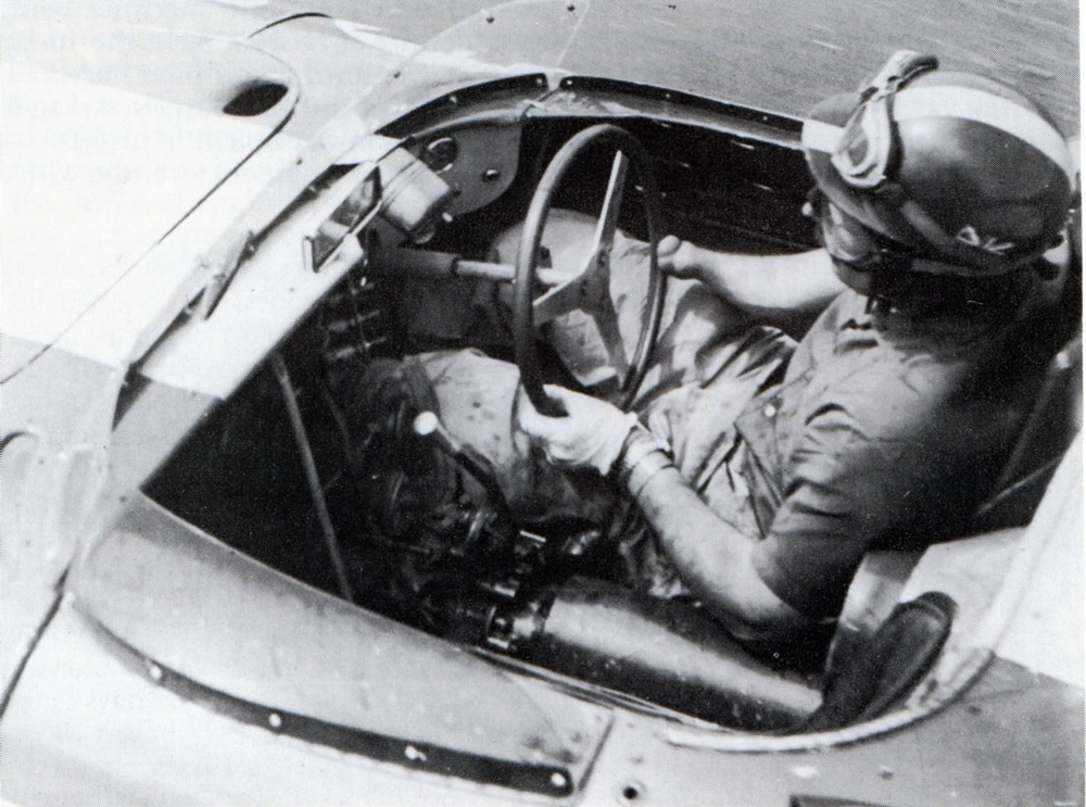 Wigram 25 Jan 58 – Archie Scott-Brown in his Lister Jaguar. Archie was born with a deformed lower right arm, and he had no right hand, yet he drove with much speed and skill – photo Peter Greenslade in ‘Powered by Jaguar’ by Doug Nye page 105.
